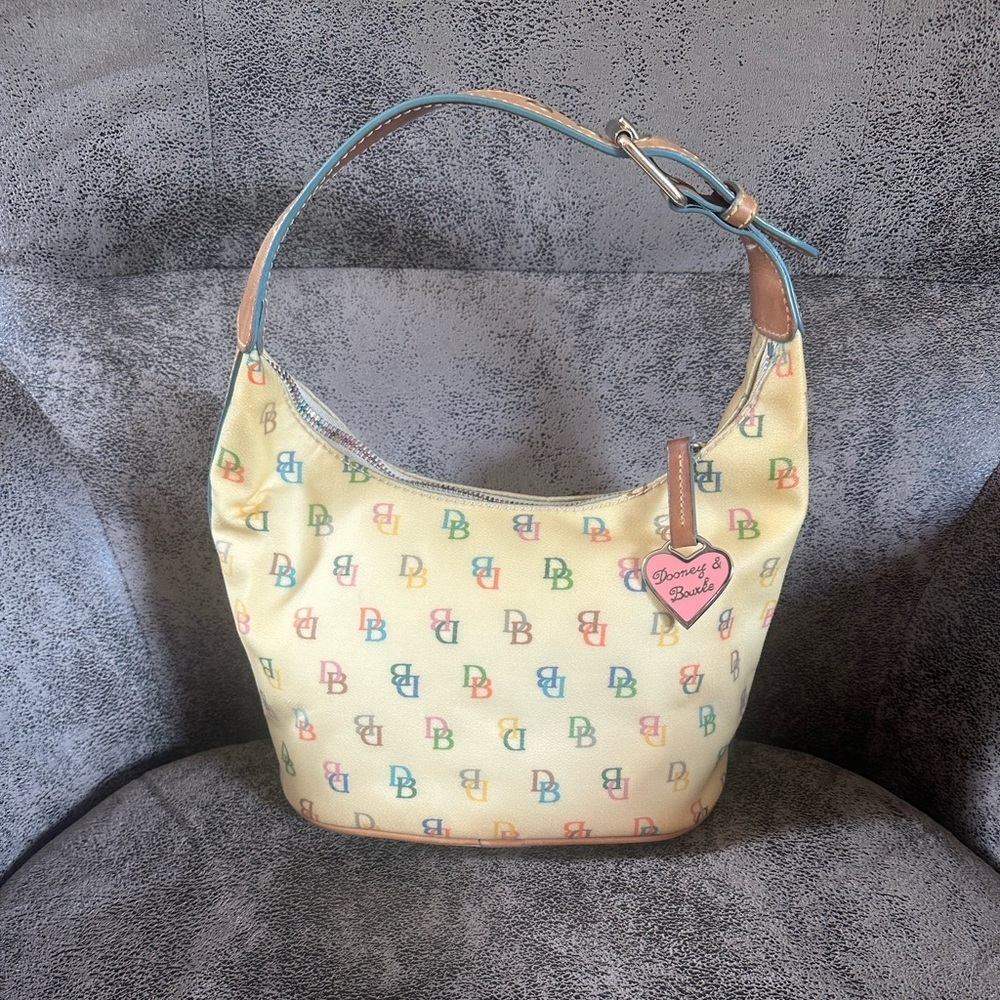 Vintage Y2K Dooney and Bourke rainbow cream- Note the leather is yellowed